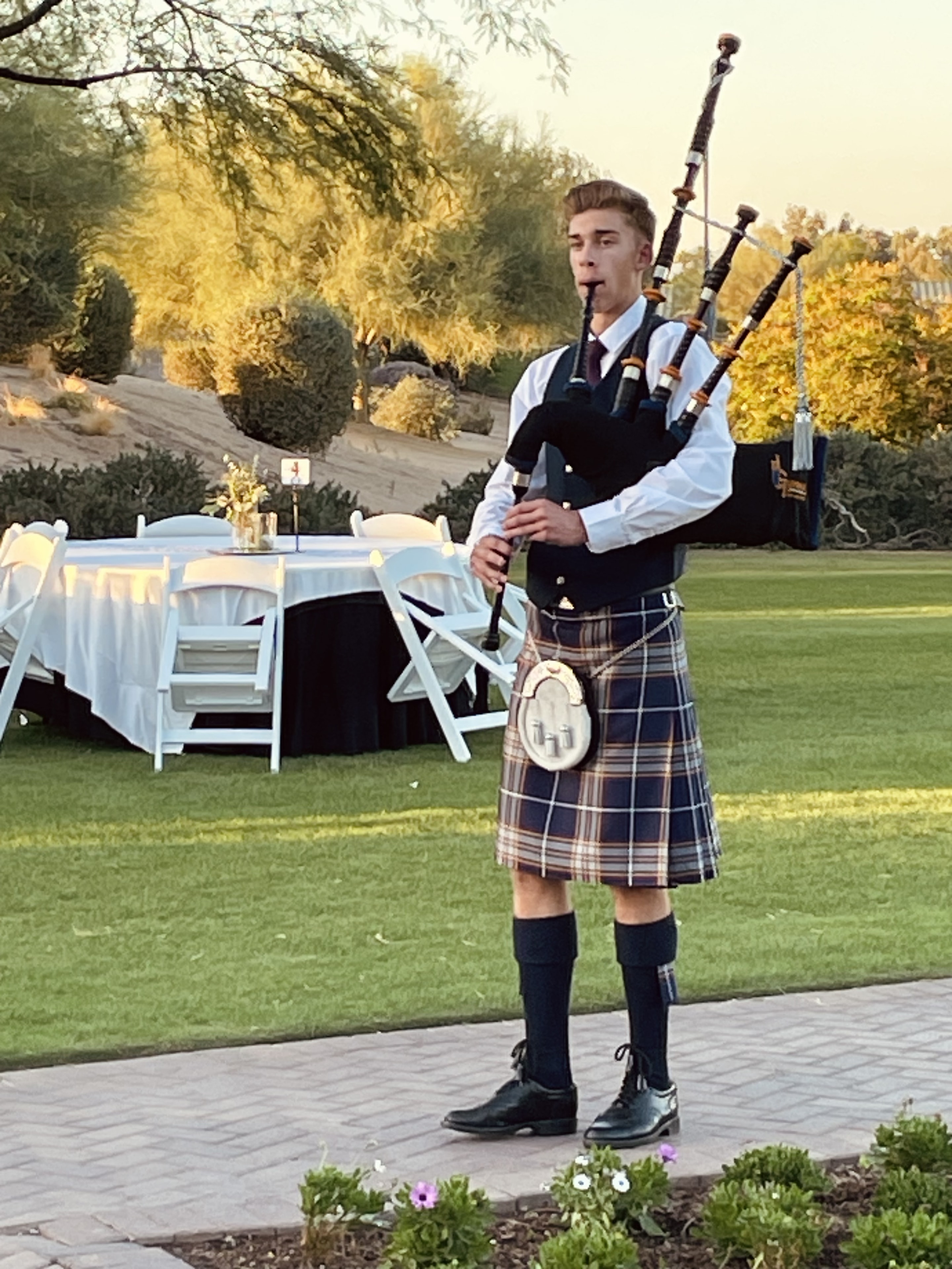 Musician performing at an outdoor ceremony